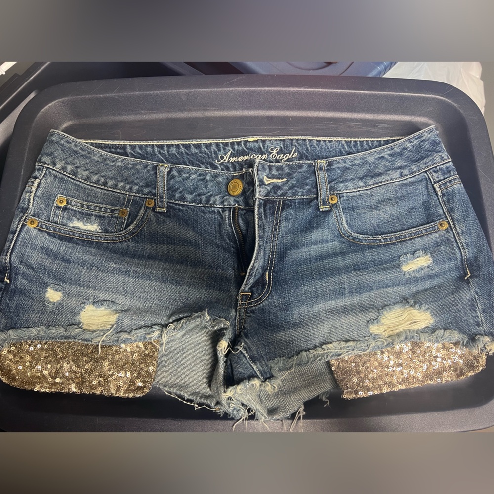 American Eagle denim shorts with copper glitter pockets